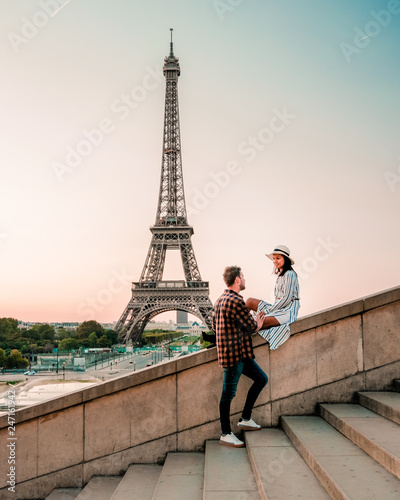 couple men and woman watching sunrise by eiffel tower paris, Eiffel tower Paris, Asian woman and European men on citytrip in Paris France by Eiffel tower