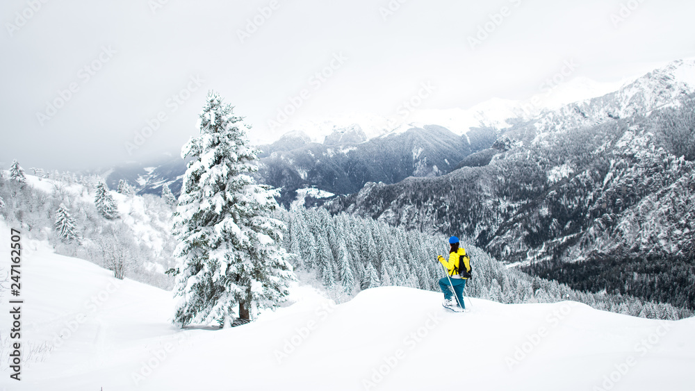 Winter landscape in a solitary snowshoeing on the Alps