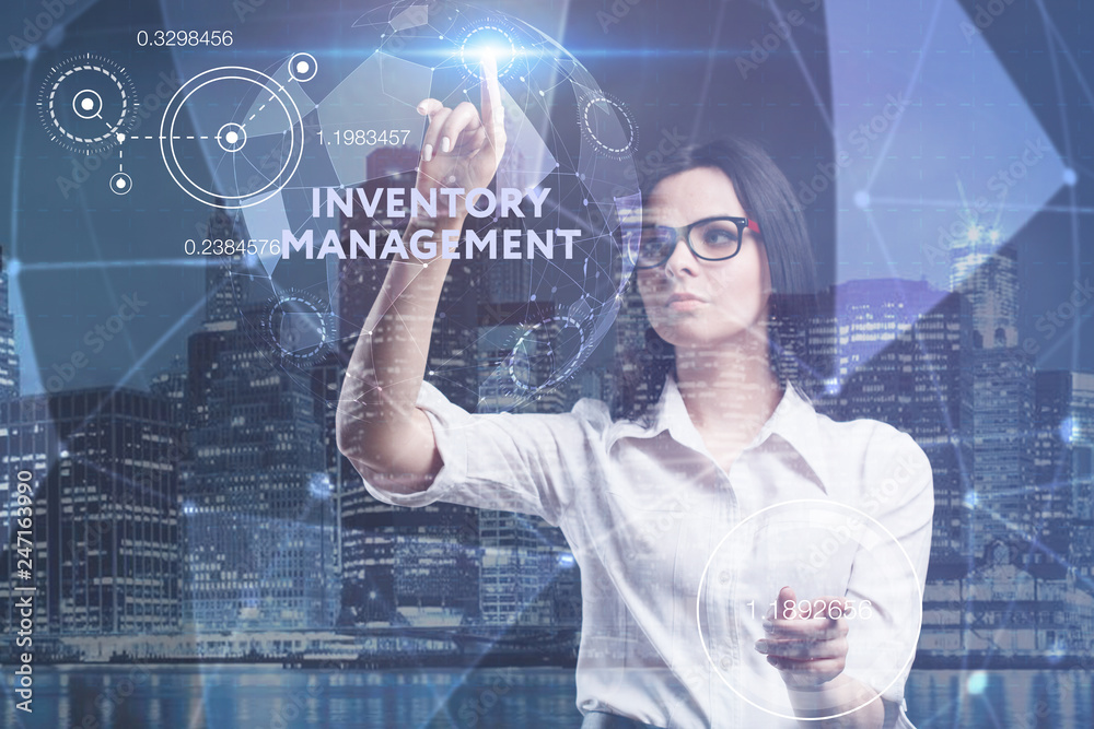 The concept of business, technology, the Internet and the network. A young entrepreneur working on a virtual screen of the future and sees the inscription: Inventory management The concept of business, technology, the Internet and the network. A young entrepreneur working on a virtual screen of the future and sees the inscription: Inventory management