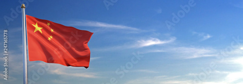 Flag of China rise waving to the wind with sky in the background photo
