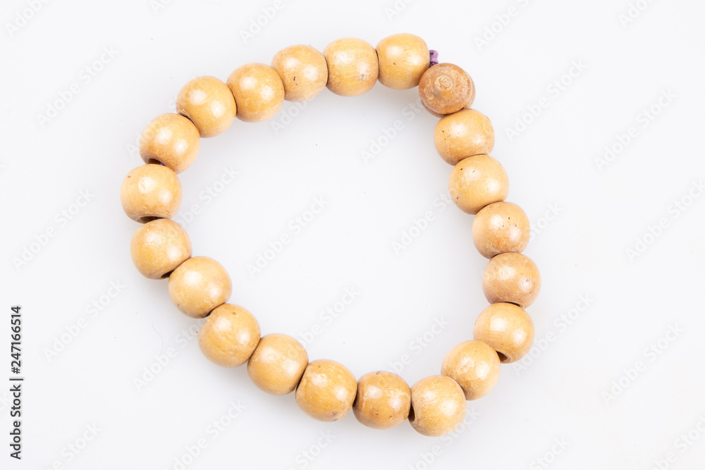 wood bracelet in wooden beads on white background wood bracelet in wooden beads on white background