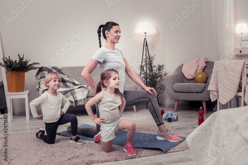Mother and her children doing exercises together