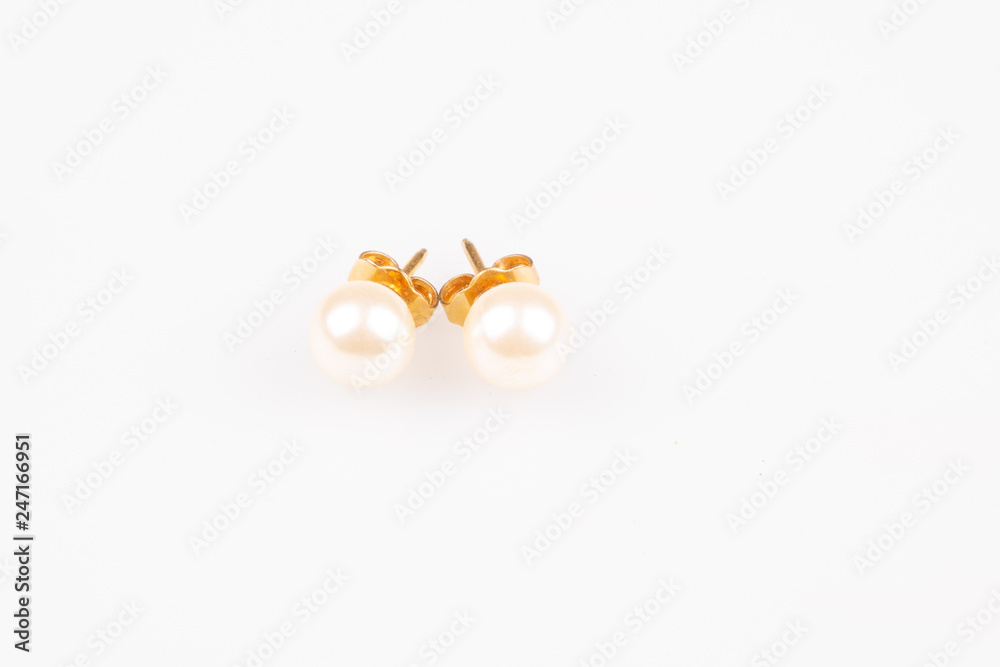 two earings pearls white round gem on clear background