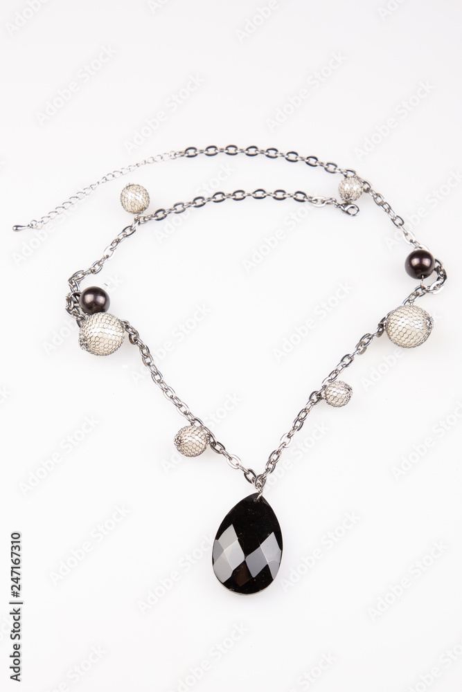 glamour fashion necklace homemade jewelry black stone under white background glamour fashion necklace homemade jewelry black stone under white background
