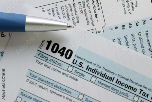United States federal income tax return IRS 1040 document with blue pen