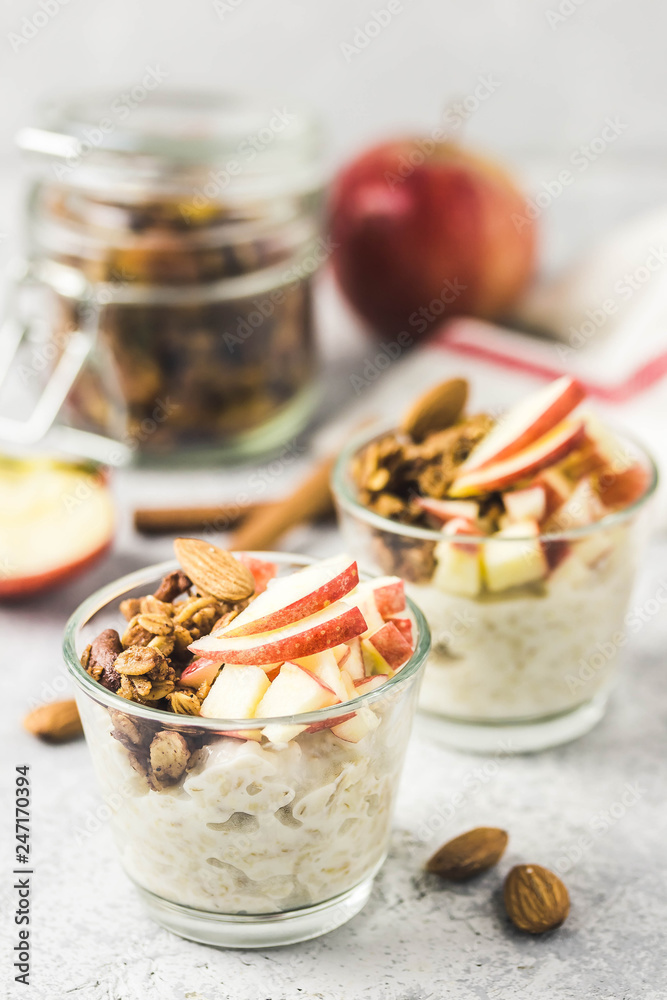Spiced apple cinnamon overnight oats, healthy breakfast. Selective focus, space for text. Spiced apple cinnamon overnight oats, healthy breakfast. Selective focus, space for text.