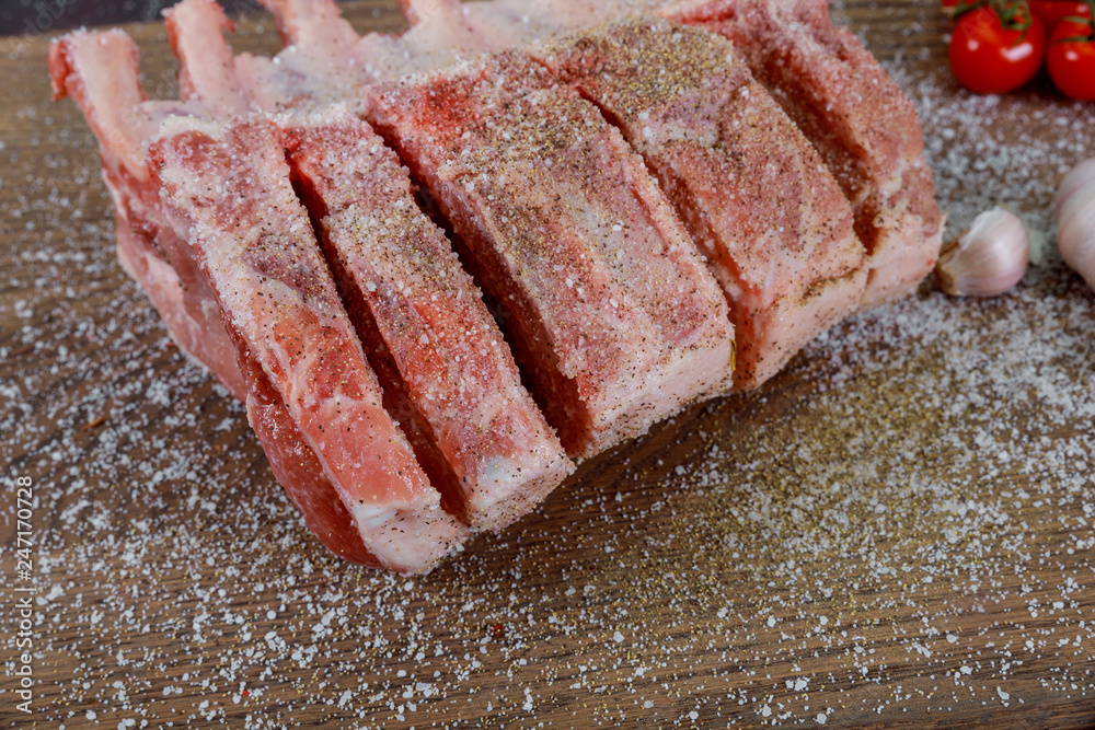Fresh raw meat pork on cutting board decorated