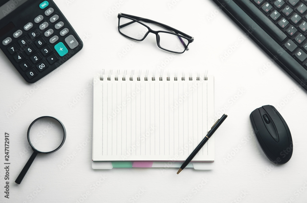 Business objects on white desk. Business objects on white desk.