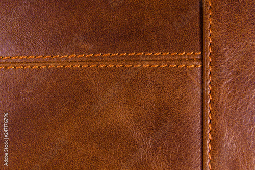 Texture of the natural brown leather and stitches