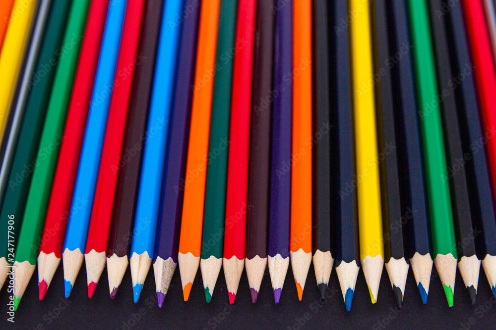 Background from colored pencils on a black surface. Background from colored pencils on a black surface.