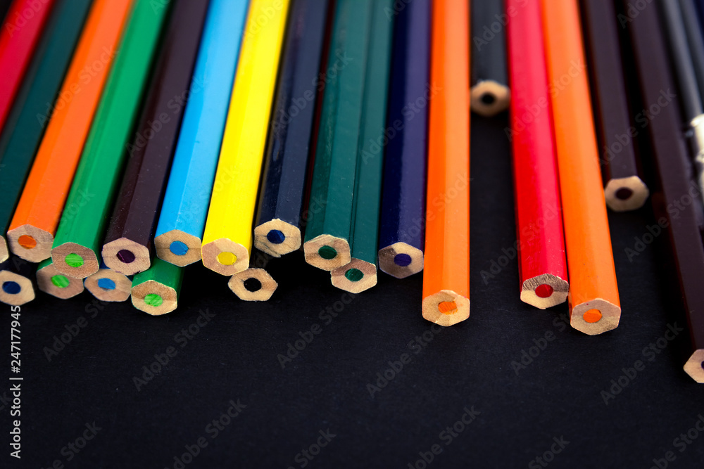 Background from colored pencils on a black surface. Background from colored pencils on a black surface.