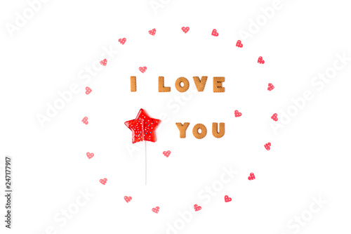 Valentine's day concept. Declaration of love, frame made of paper hearts, lollipop in form star. Flat lay, top view, white background, isolated, copy space