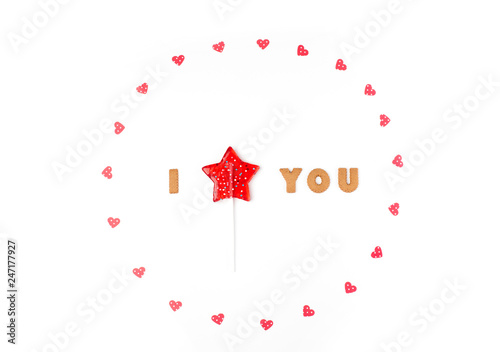 Valentine's day concept. Declaration of love, frame made of paper hearts, lollipop in form star. Flat lay, top view, white background, isolated, copy space