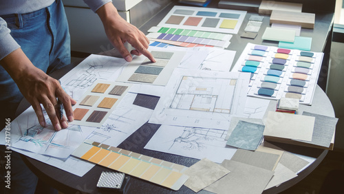 Architect designer Interior creative working hand drawing sketch plan blue print selection material color samples art tools Design Studio
