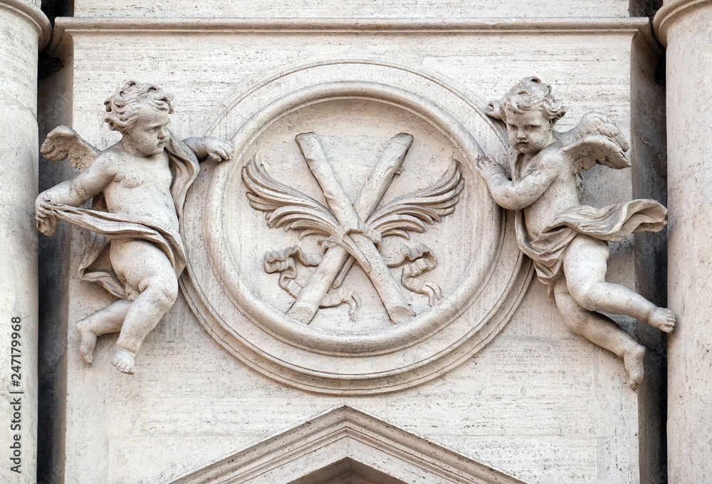 Angels with symbols of martyrdom on the portal of Sant Andrea della Valle Church in Rome, Italy 
