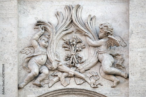 Angels with symbols of martyrdom on the portal of Sant Andrea della Valle Church in Rome, Italy