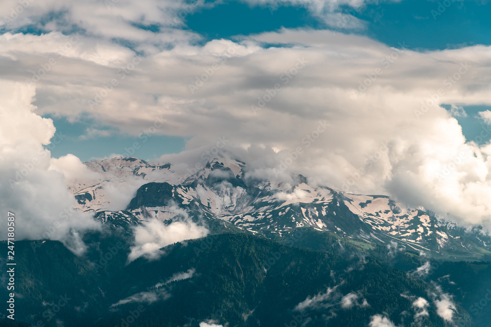 Beautiful landscape of peaks of the Caucasus Mountains and clouds