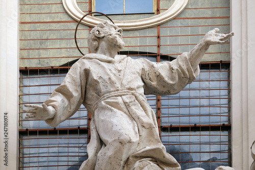 Stucco statue of St Francis Receiving the Stigmata on the facade of Santissime Stimmate di San Francesco church, Rome, Italy  photo