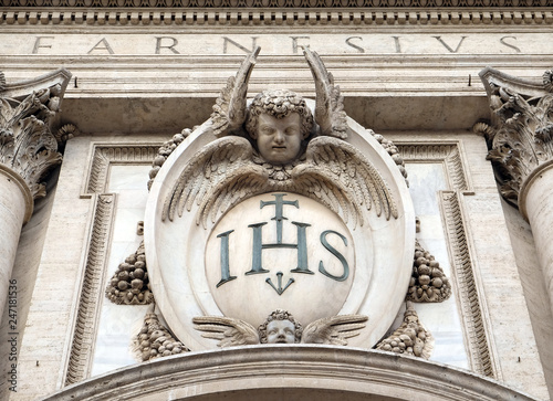 Christogram IHS, facade of the Church of the Gesu, mother church of the Society of Jesus, Rome, Italy  photo