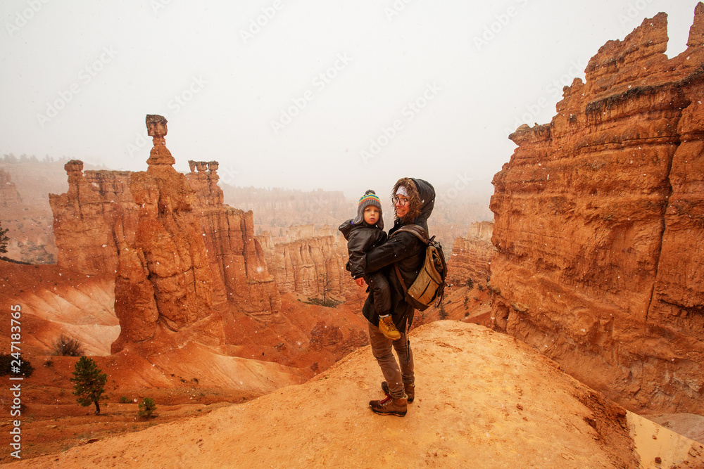 Mother with son are hiking in Bryce canyon National Park, Utah, USA Mother with son are hiking in Bryce canyon National Park, Utah, USA