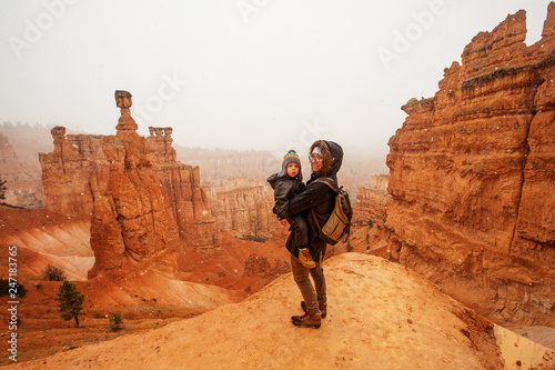 Mother with son are hiking in Bryce canyon National Park, Utah, USA