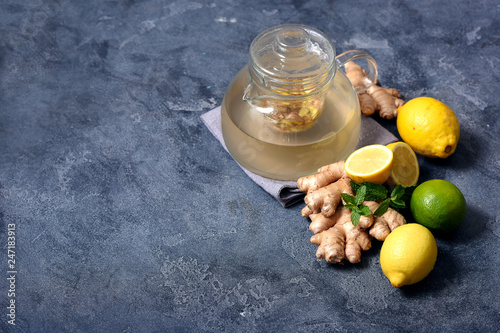 Healthy ginger tea, hot vitamin drink with lemons, copy space background