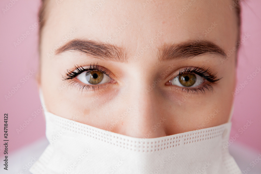 Portrait of a young woman in a medical mask. Protection against viruses