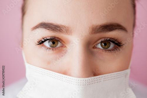 Portrait of a young woman in a medical mask. Protection against viruses