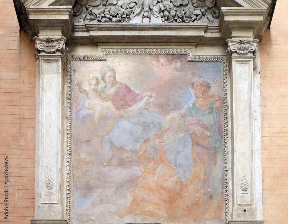 Our Lady holding the Christ Child and seated on the clouds, with Saints Peter and Paul looking on in adoration Church of San Giovanni della Pigna, Rome, Italy