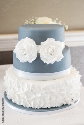 Wedding cake with white rose icing decoration
