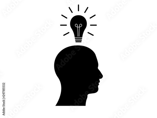 Side view of human head with a light bulb above it, illustrating having an idea. 