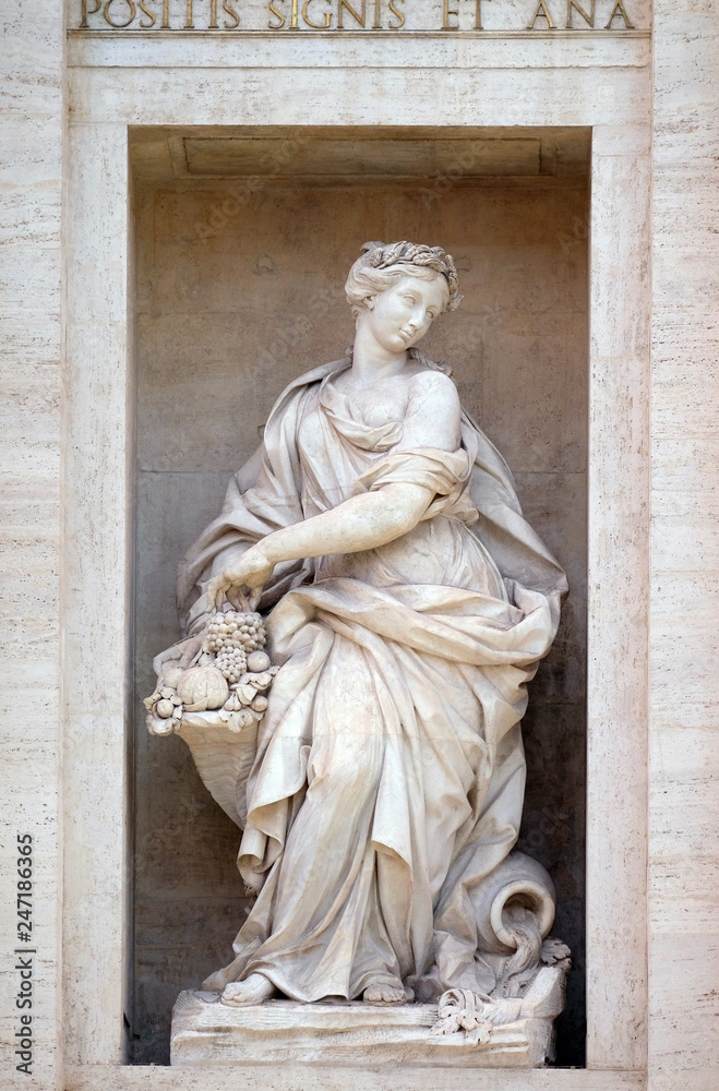 The statue of Abundance of the Trevi Fountain in Rome. Fontana di Trevi is one of the most famous landmark in Rome, Italy 