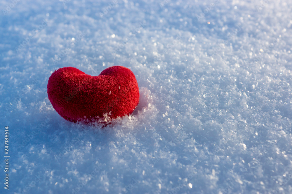 Fototapeta premium Love heart in snow on valentines day
