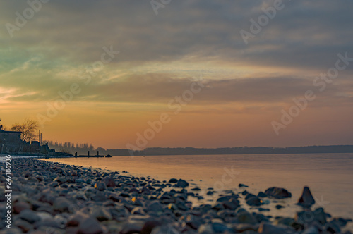 Rocky Baltic sea beach at sunset