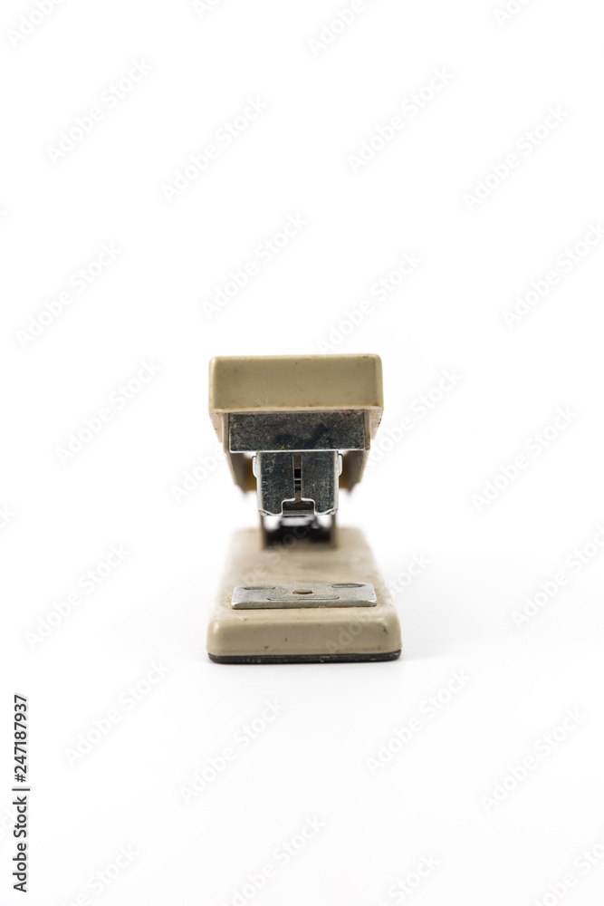 Cream stapler stationery on white background Cream stapler stationery on white background