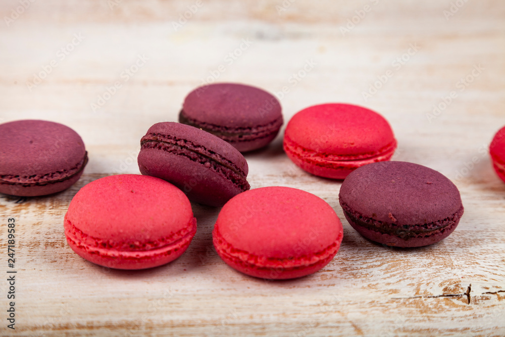 Berry macaroons on a wooden background Berry macaroons on a wooden background