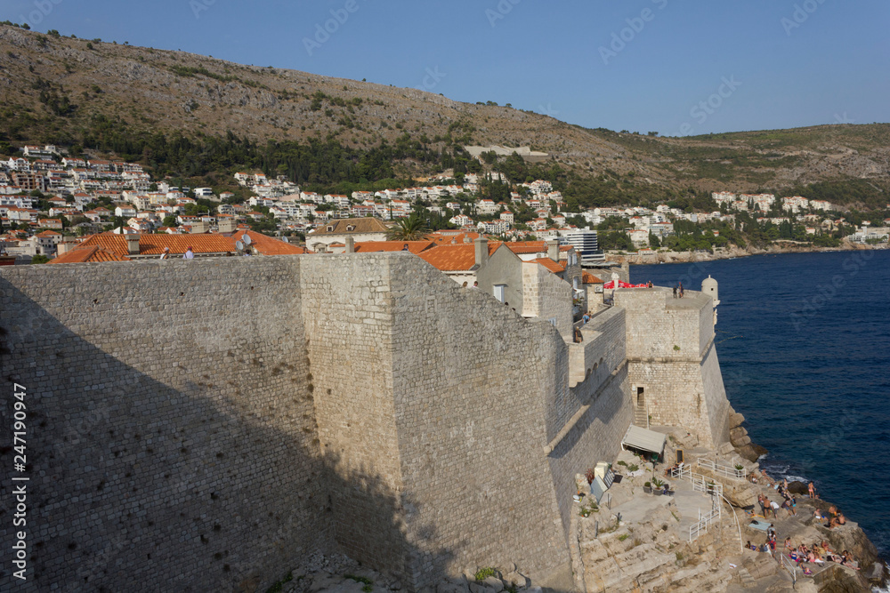 DUBROVNIK, CROATIA - AUGUST 22 2017: Ancient dubrovnik walls overlooking the adriatic sea