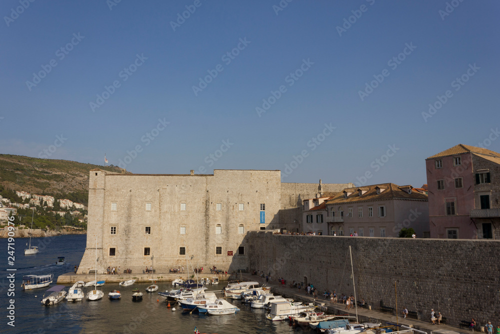 DUBROVNIK, CROATIA - AUGUST 22 2017: Dubrovnik harbour and walls