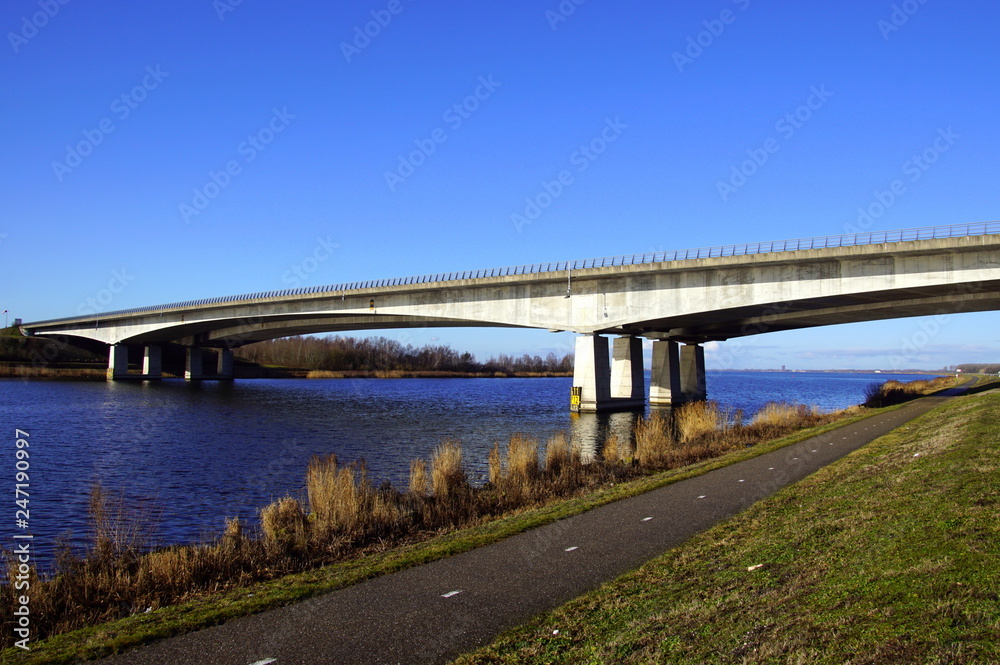 Dutch highway A27 bridge ('' Stichtse Brug '') connecting Dutch provinces Noord-Holland and Flevoland. Dutch highway A27 bridge ('' Stichtse Brug '') connecting Dutch provinces Noord-Holland and Flevoland.