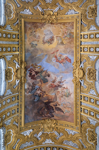 The fresco The Fall of the Rebelious Angels on the vault of nave by Giacinto Brandi in Basilica dei Santi Ambrogio e Carlo al Corso, Rome, Italy photo