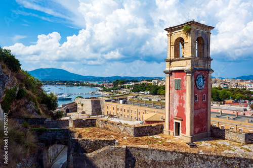 Abandoned clock tower in old fortress in Corfun with panoramic view of Corfu town, Greece. photo