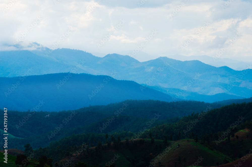 natural landscape mountain great peak national in Thailand silhouette blue range view on morning beautiful with smoky. travel outdoor valley countryside hiking or trekking winter season. natural landscape mountain great peak national in Thailand silhouette blue range view on morning beautiful with smoky. travel outdoor valley countryside hiking or trekking winter season.