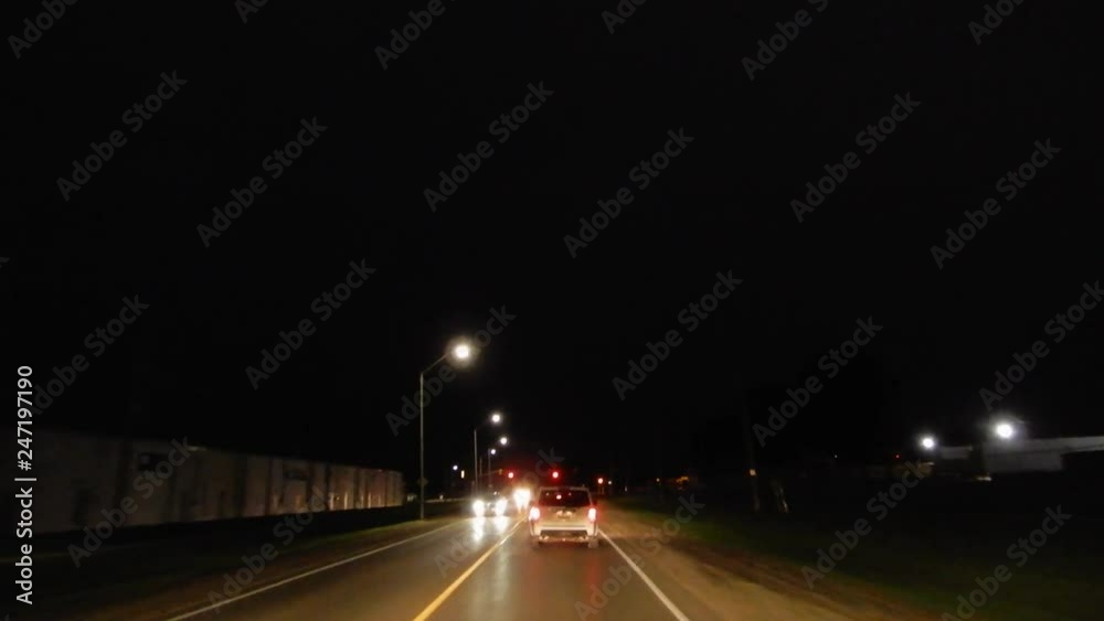 4K Driving Behind White Suv Car And Coming To A Stoplight In The Evening With Warehouse On Left Side 4K Driving Behind White Suv Car And Coming To A Stoplight In The Evening With Warehouse On Left Side