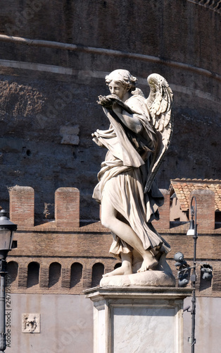 Statue of Angel with the Sudarium (Veronica's Veil) by Cosimo Fancelli, Ponte Sant Angelo in Rome, Italy  photo