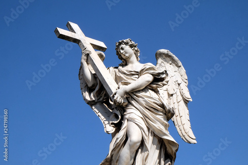Statue of Angel with the Cross by Ercole Ferrata, Ponte Sant Angelo in Rome, Italy   photo