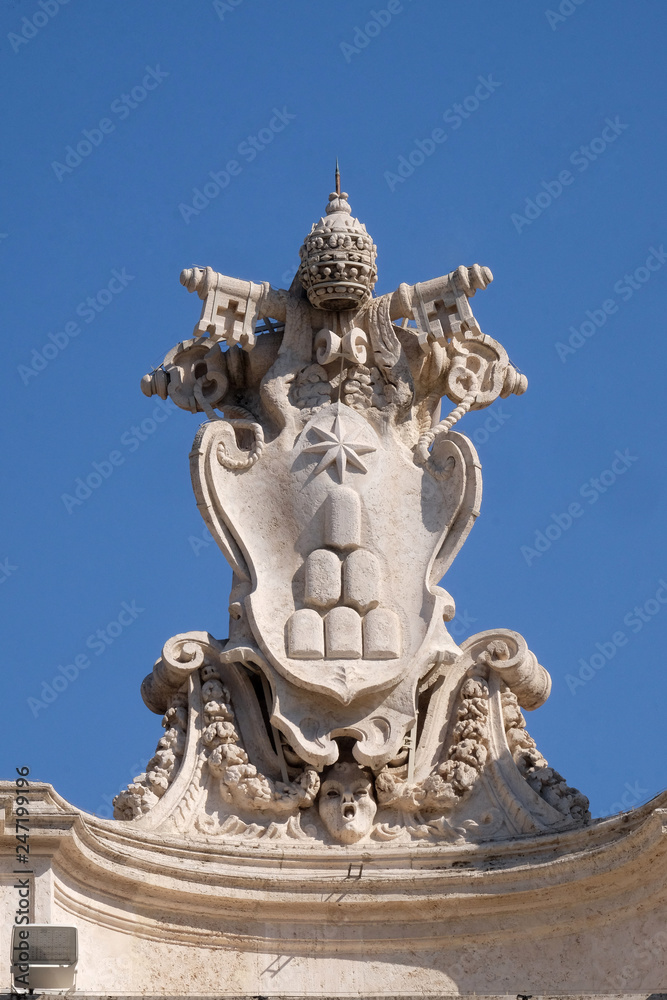 Alexander VII Coat of Arms, fragment of colonnade of St. Peters Basilica. Papal Basilica of St. Peter in Vatican, Rome, Italy 