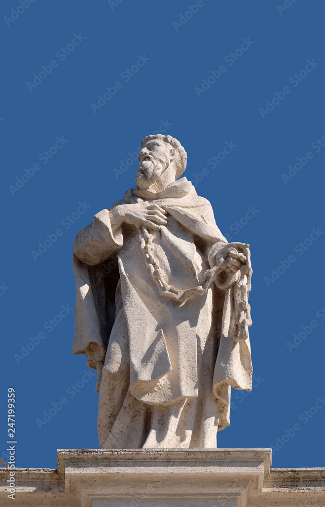 St. John of Matha, fragment of colonnade of St. Peters Basilica. Papal Basilica of St. Peter in Vatican, Rome, Italy 