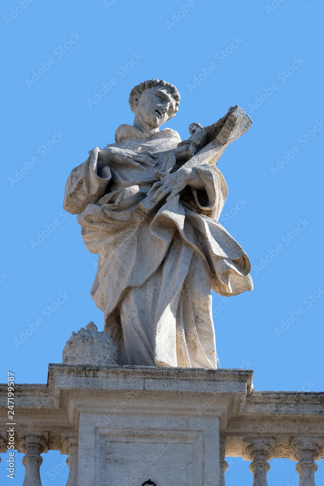 St. Philip Benizi, fragment of colonnade of St. Peters Basilica. Papal Basilica of St. Peter in Vatican, Rome, Italy 