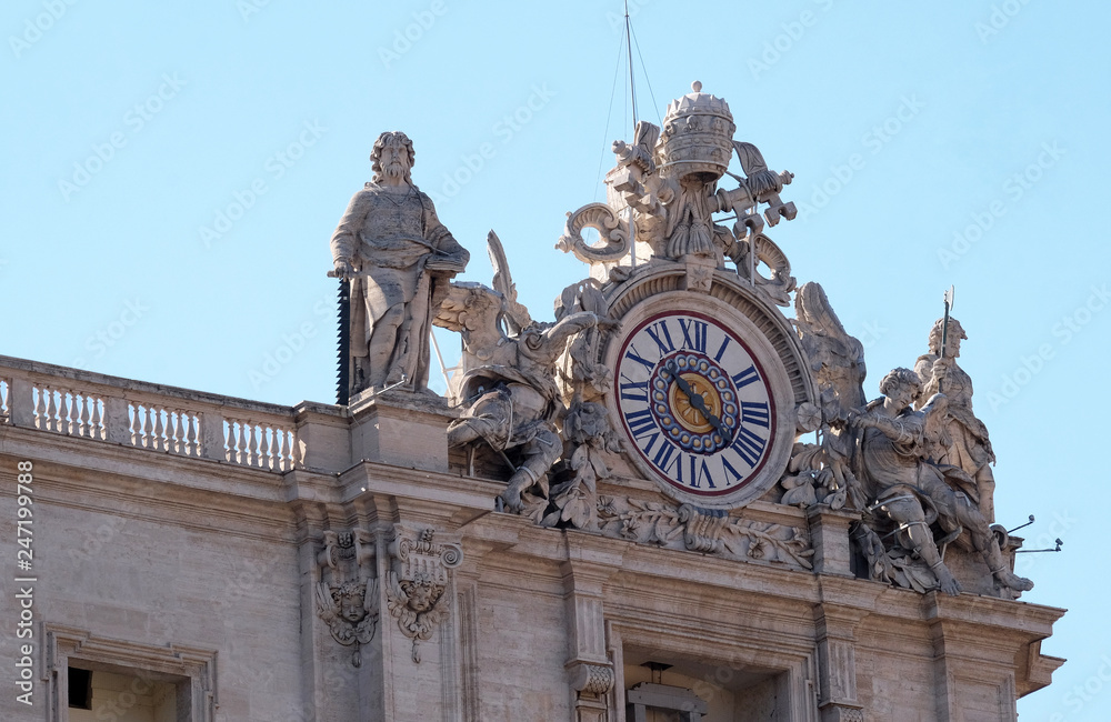One of the giant clocks on the St. Peter's facade. Two clocks were added in 1786-1790 by Giuseppe Valadier. Papal Basilica of St. Peter in Vatican, Rome, Italy