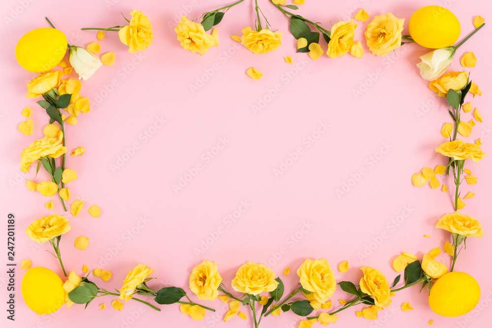 Frame of flowers in the eggs on a pink background. Top view with copy space..